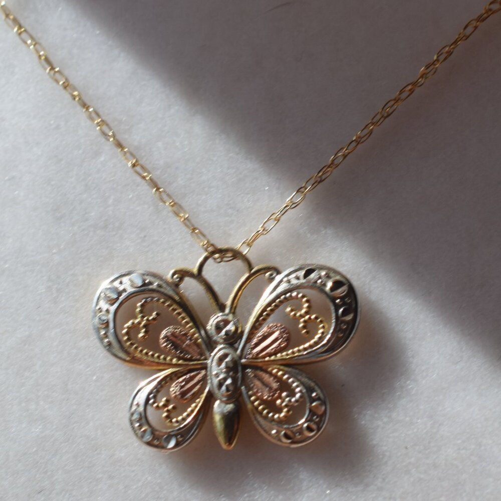 Coleman Company 10k. solid gold with 12k. black hills gold butterfly necklace